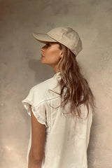 A model weearing Cove. caps in sand colour