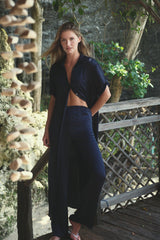 Essentia Pants in Navy, showing the slim fit and subtle flare through the hem.