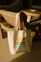Unisex cotton canvas tote bag with sun-and-palm graphic, spacious and durable