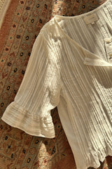 Detail photo of the Sonora White Top with frill sleeves.
