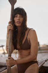 Model wears triangle bikini set in choclate colour