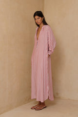 Front view of the Toulouse Dress in washed red Amalfi Stripe featuring a relaxed kaftan silhouette and balloon sleeves.