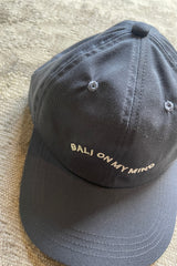 Close up of We Like Bali The Label Bali On My Mind Caps in navy