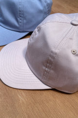 Details of a new Cove. cap in colour pale pink and sky blue