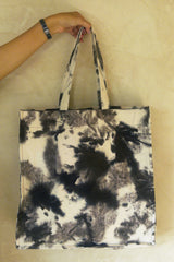 Eco-friendly cotton tie-dye bag in brown tones, shoulder carry.