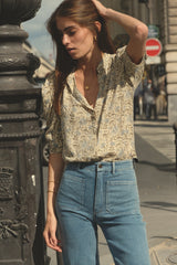 Model wearing Molly Denim Jean in Pale Blue with floral button-up shirt