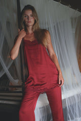 High-rise satin pants with a slight flared hem.