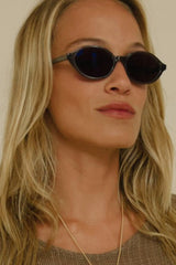 side view of black sunglasses by Cove and Maison Mata