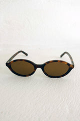 Front view of tortoiseshell sunglasses by Maison Mata