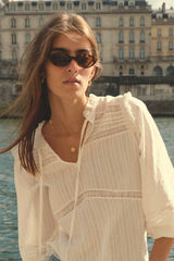 A woman wearing Tortoisesell with Caramel Lens sunglasses by Maison Mata x Cove