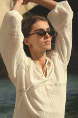 A woman wearing Cove sunglasses in Tortoisesell with Caramel Lens by Maison Mata