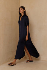 Model showing the side split of the Hutton Shirt in navy with button front.