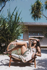a woman wearing a fringed sarong