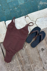 Flat lay of ribbed one piece swimsuit can be worn as bodysuit