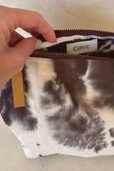 Close-up of textured cotton and gold zip on Tie Dye Pouch by Cove
