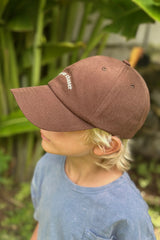 a kid wearing brown hat