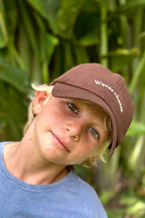a kid wearing brown hat