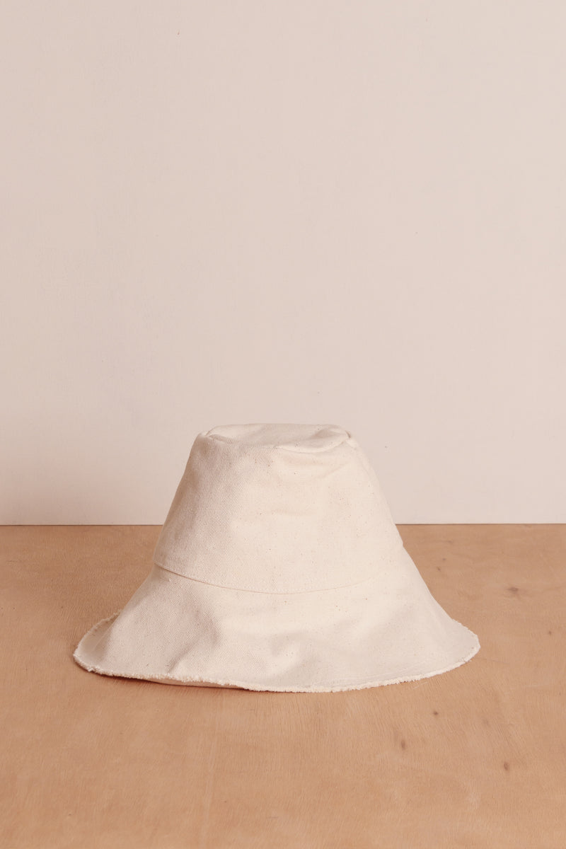Ivory bucket hat by cove. island essentials