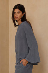 Close-up of the soft open-knit texture on the Allegra Mesh Top
