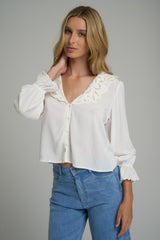 White cotton blouse with scallop hem sleeves