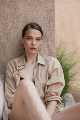 A model wearing a natural cotton shirt dress