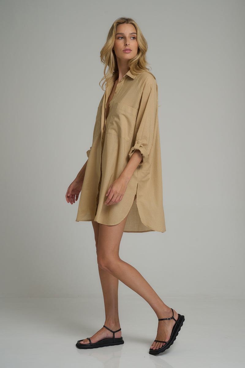 A model wearing a natural cotton casual shirt dress