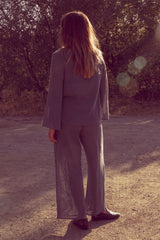 Back view of Olivia wearing the Allegra Mesh Top & Fenton Pants as a relaxed set.