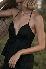 A model wearing a black summer cotton top