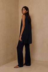 Model wearing the satin navy Marlowe mini which can be worn as a tunic top