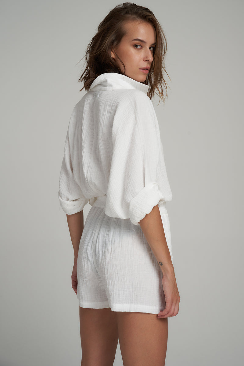 Back View of a White Cotton Jumpsuit with Long Sleeves