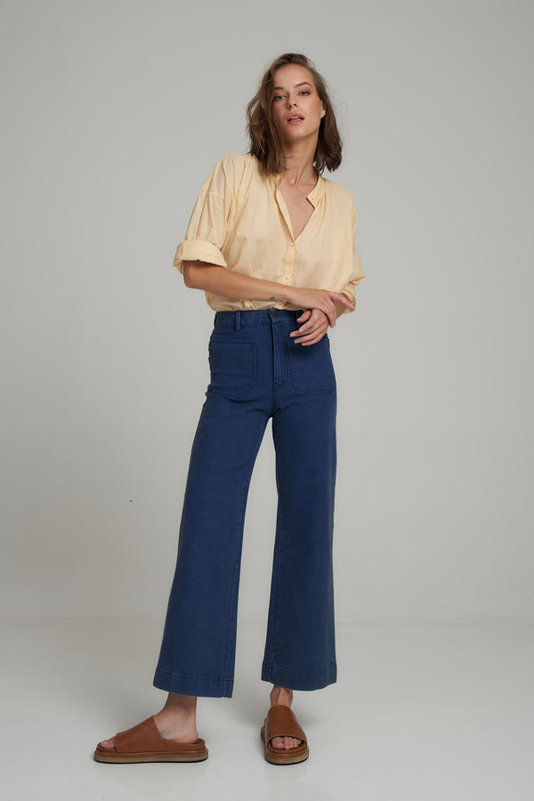 A Model Wearing a Blue High Rise Denim Jeans  