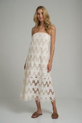 A model wearing norfolk strapless lace ivory dress by Lilya