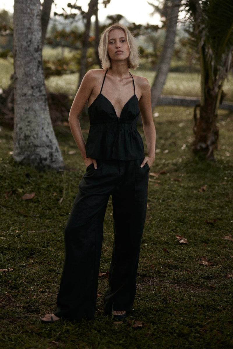 A model wearing black linen pants in Australia by Lilya