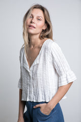 A model wearing the sonora in ivory colour for summer by Lilya 