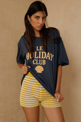 Yellow knit shorts styled with a casual cotton tee