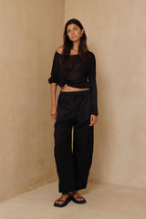 Coconut Pants in Black styled as lightweight everyday trousers for the beach, travel and casual wear.