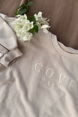 close up look of cove. sweater shirt in sand color
