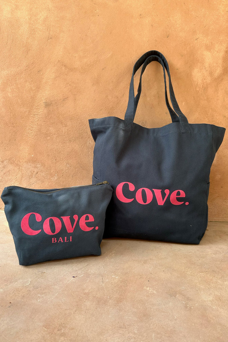 cove flock clutch bag in navy and pink color 