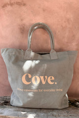 a close up look of cove island essentials tote bag