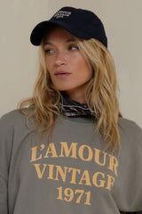 Navy embroidered logo cap on model