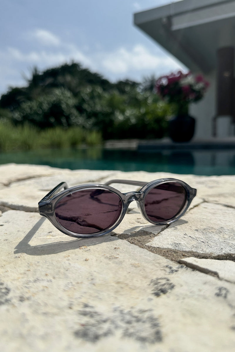 Front view of grey sunglasses by Maison Mata x Cove.