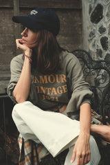 Model wears logo cap in navy