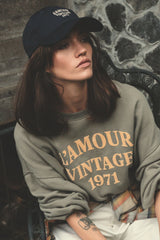 Model wears navy baseball cap by LILYA