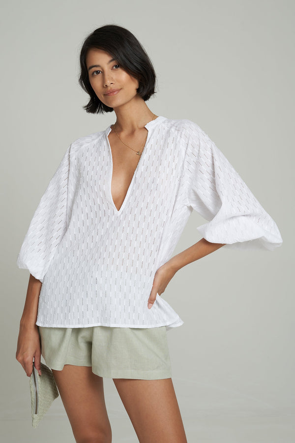 a woman wearing white top for summer in Australia