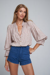 A Model Wearing 70's Style High Rise Denim Blue Shorts
